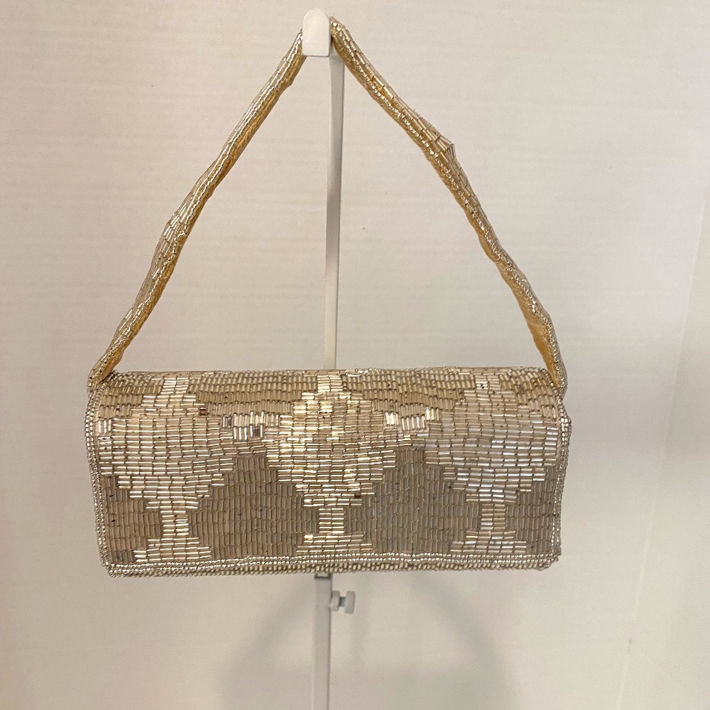 La Regale small silver beaded clutch purse with strap